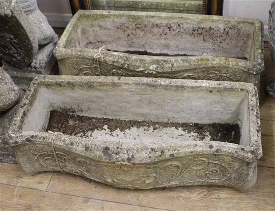 A pair of serpentine-fronted reconstituted stone rectangular planters, L 74cm